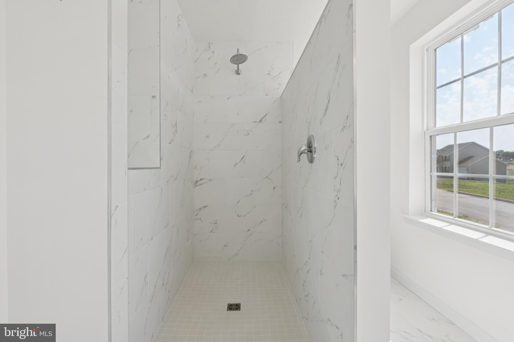 625 Ripple Drive, Unit 187 Hanover, PA 17331 - Photo 14 of 20 a bathroom with a glass shower door