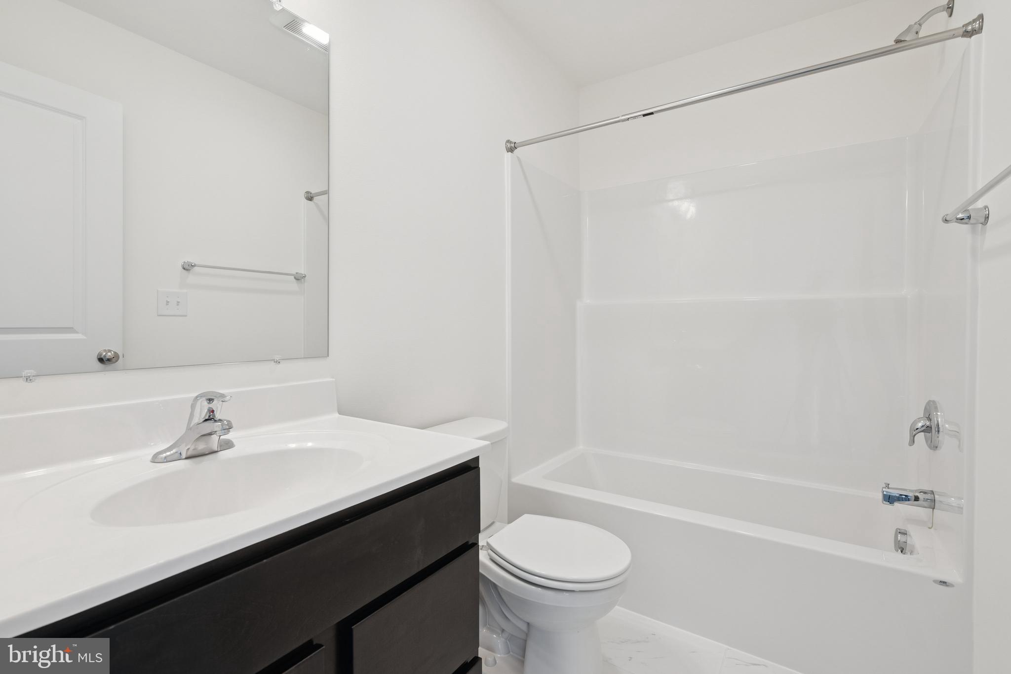 625 Ripple Drive, Unit 187 Hanover, PA 17331 - Photo 19 of 20 a bathroom with a sink a toilet and shower