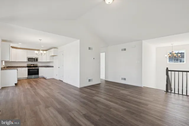 a view of kitchen with wooden floor