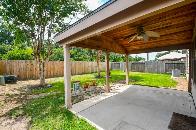 a front view of house with a garden