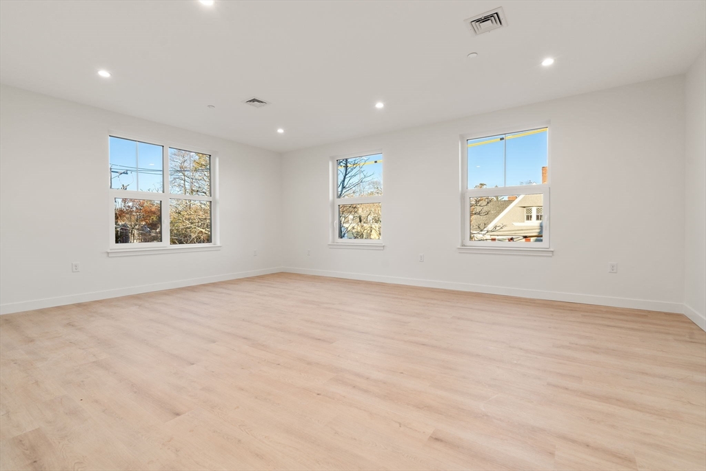 1151 Walnut Street, Unit 201 Newton, MA 02461 - Photo 19 of 31 a view of an empty room and a window