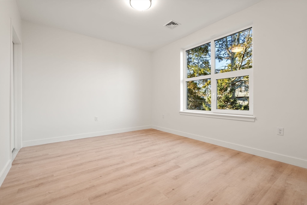1151 Walnut Street, Unit 201 Newton, MA 02461 - Photo 20 of 31 an empty room with a window