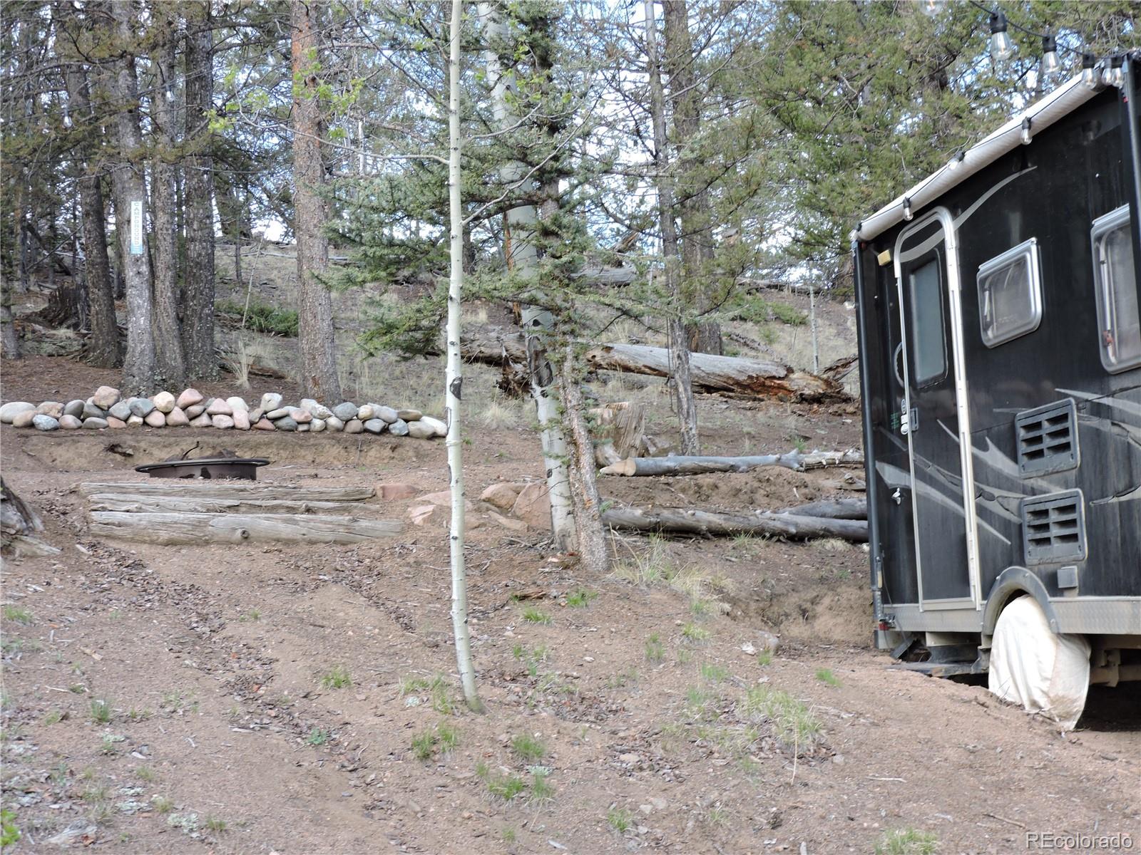 258 Old Squaw Road Como, CO 80432 - Photo 28 of 36 a view of a chairs and table in backyard