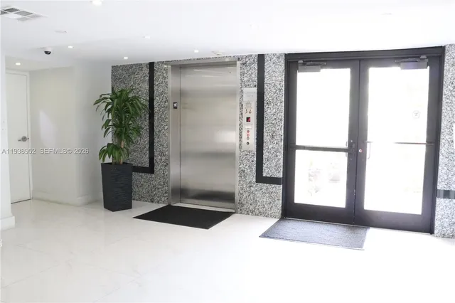 a view of a swimming pool with outdoor seating