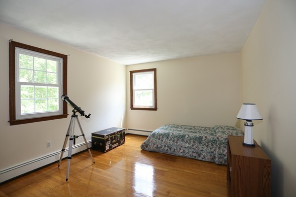 88 Warren Road Sudbury, MA 01776 - Photo 14 of 16 a bedroom with furniture and a window