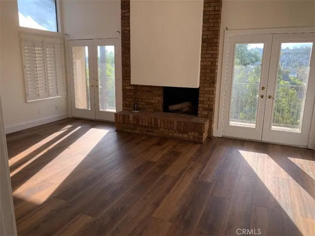 a view of livingroom with fireplace and window