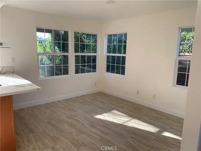 a kitchen with a sink and large window