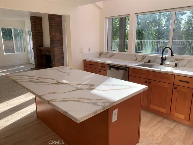 a kitchen with stainless steel appliances a refrigerator and a stove