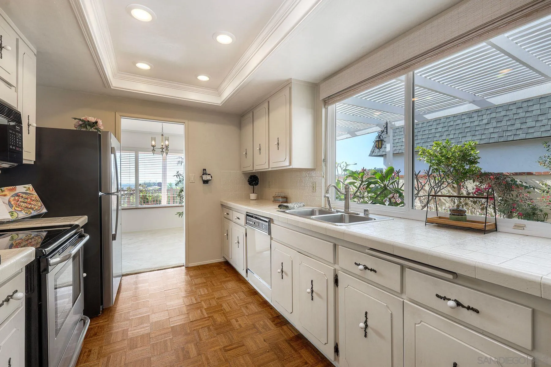3063 Conner Way San Diego, CA 92117 - Photo 15 of 52 a kitchen with a sink stove and refrigerator