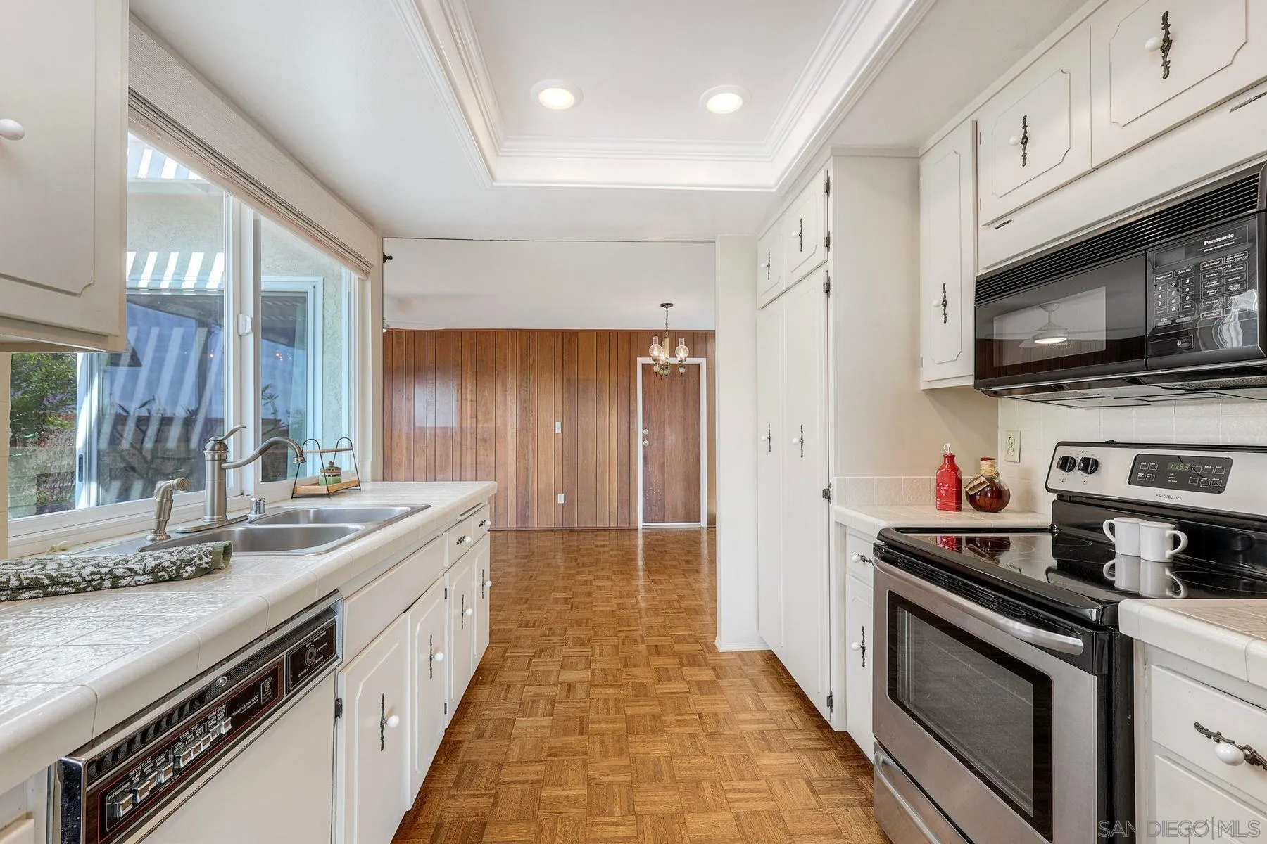 3063 Conner Way San Diego, CA 92117 - Photo 16 of 52 a kitchen with stainless steel appliances granite countertop a sink stove and refrigerator