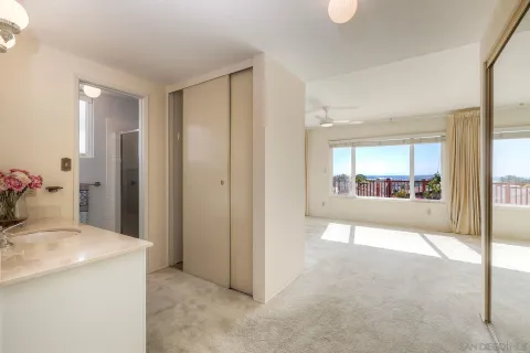 a bathroom with a sink vanity granite and a mirror