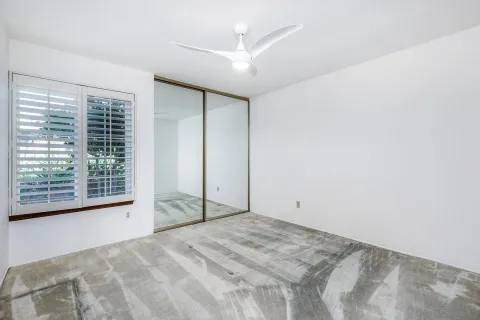 an empty room with a fan