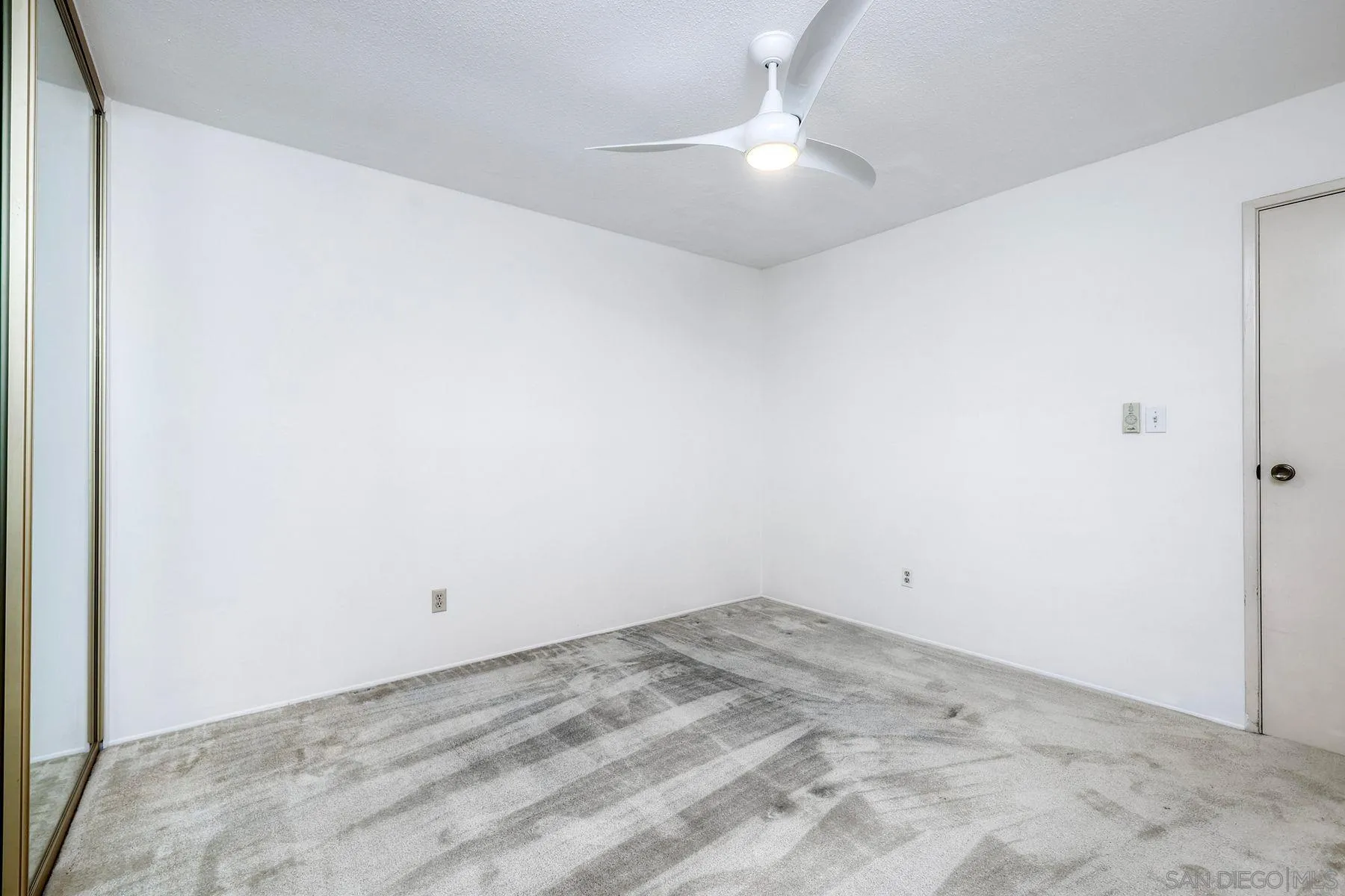 3063 Conner Way San Diego, CA 92117 - Photo 26 of 52 an empty room with a fan