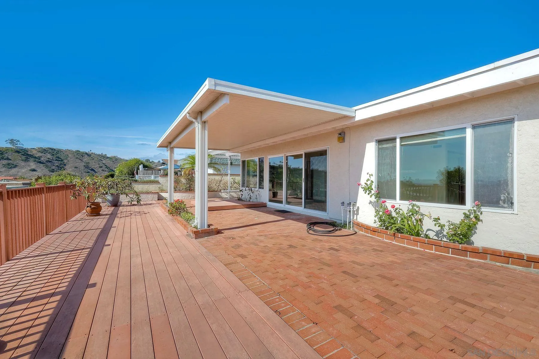 3063 Conner Way San Diego, CA 92117 - Photo 31 of 52 a view of a patio with a table and chairs