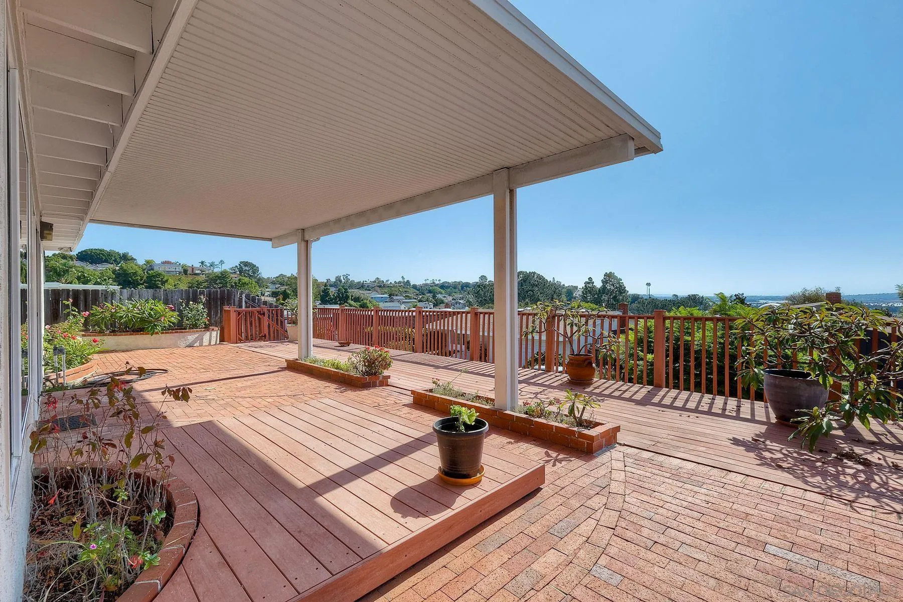 3063 Conner Way San Diego, CA 92117 - Photo 35 of 52 a view of a roof deck with couches and wooden floor