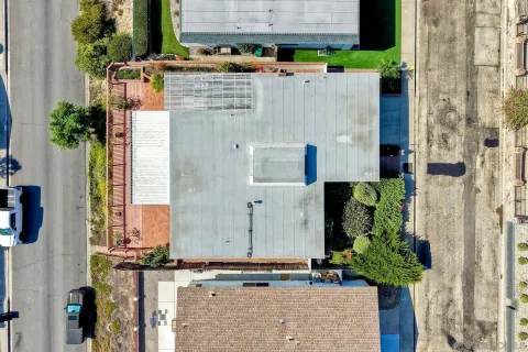 an aerial view of a house with a garden