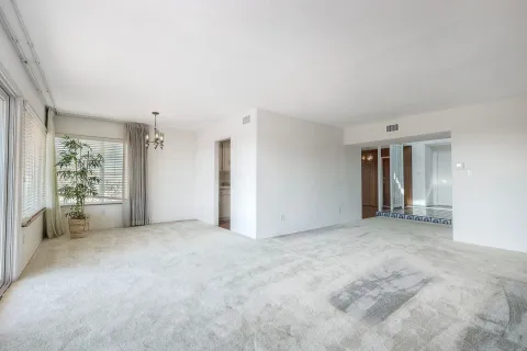 a view of a room with large windows