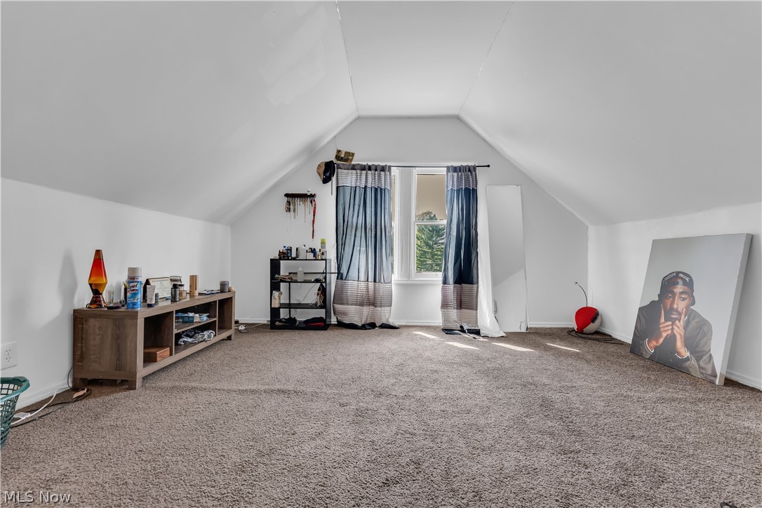 975 Yellowstone Road Cleveland Heights, OH 44121 - Photo 17 of 19 Bonus room featuring carpet floors and vaulted ceiling