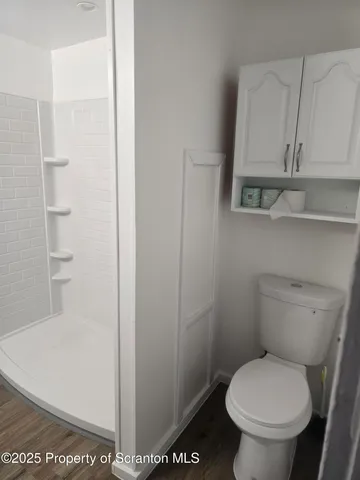 a bathroom with a toilet and a vanity