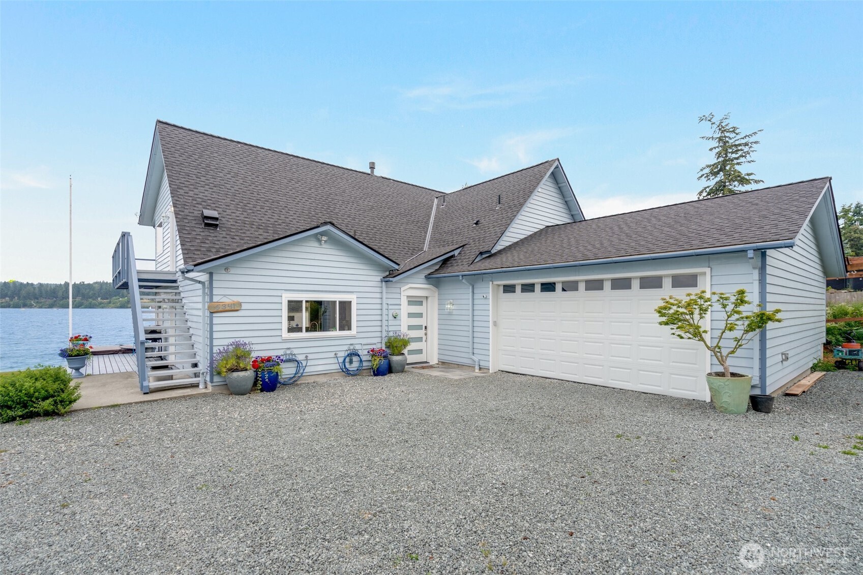 5341 South Bercot Road Freeland, WA 98249 - Photo 6 of 37 a view of a house with a yard and sitting area