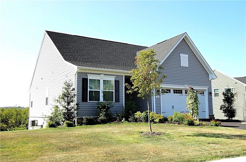 327 Crossing Drive Eighty Four, PA 15330 - Photo 1 of 34 a backyard of a house with yard and outdoor seating
