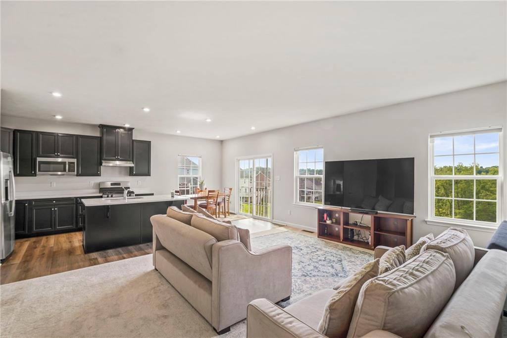 327 Crossing Drive Eighty Four, PA 15330 - Photo 11 of 34 a living room with furniture and a flat screen tv