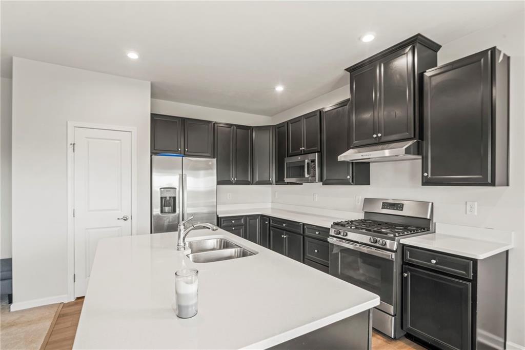 327 Crossing Drive Eighty Four, PA 15330 - Photo 14 of 34 a kitchen that has a sink stainless steel appliances and cabinets