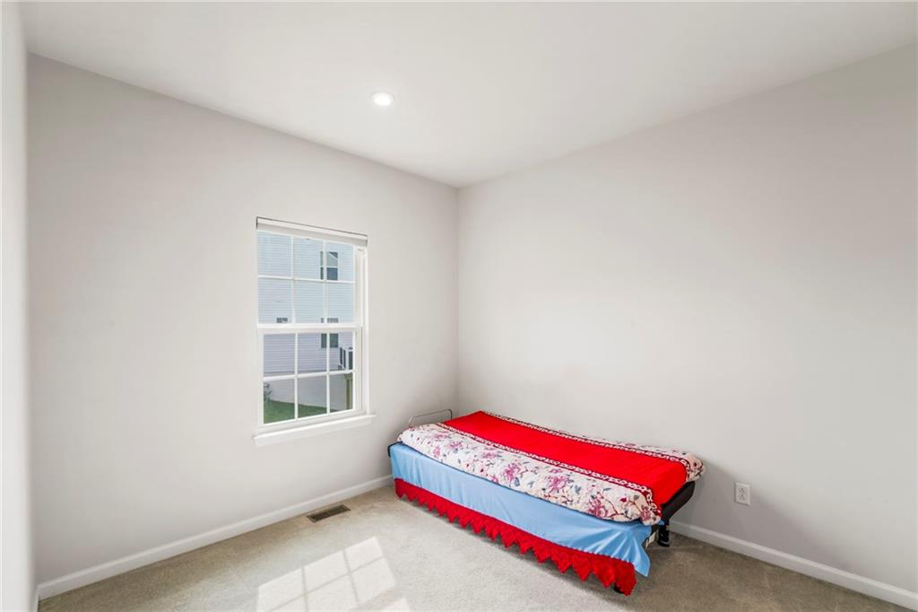 327 Crossing Drive Eighty Four, PA 15330 - Photo 24 of 34 a room with a bed and a window