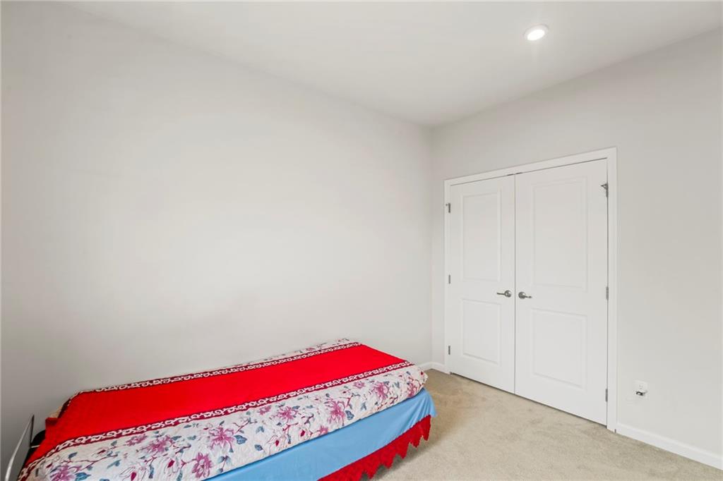 327 Crossing Drive Eighty Four, PA 15330 - Photo 25 of 34 a view of a bedroom with a large bed and mirror