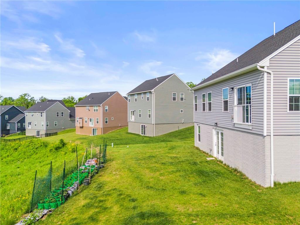 327 Crossing Drive Eighty Four, PA 15330 - Photo 33 of 34 a front view of house with yard and green space