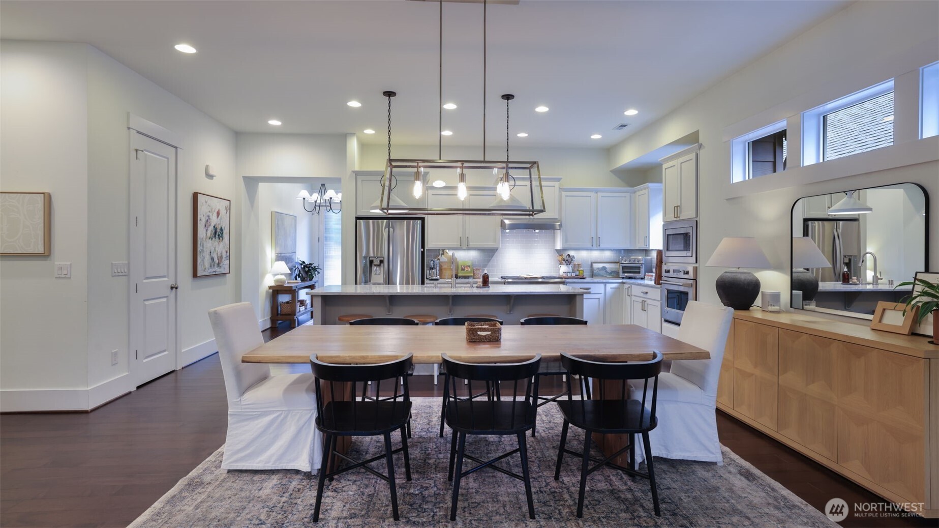 629 Field Place Northeast Renton, WA 98059 - Photo 12 of 37 a kitchen with kitchen island a dining table and chairs