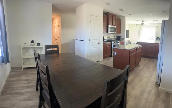 a kitchen with a table and chairs in it