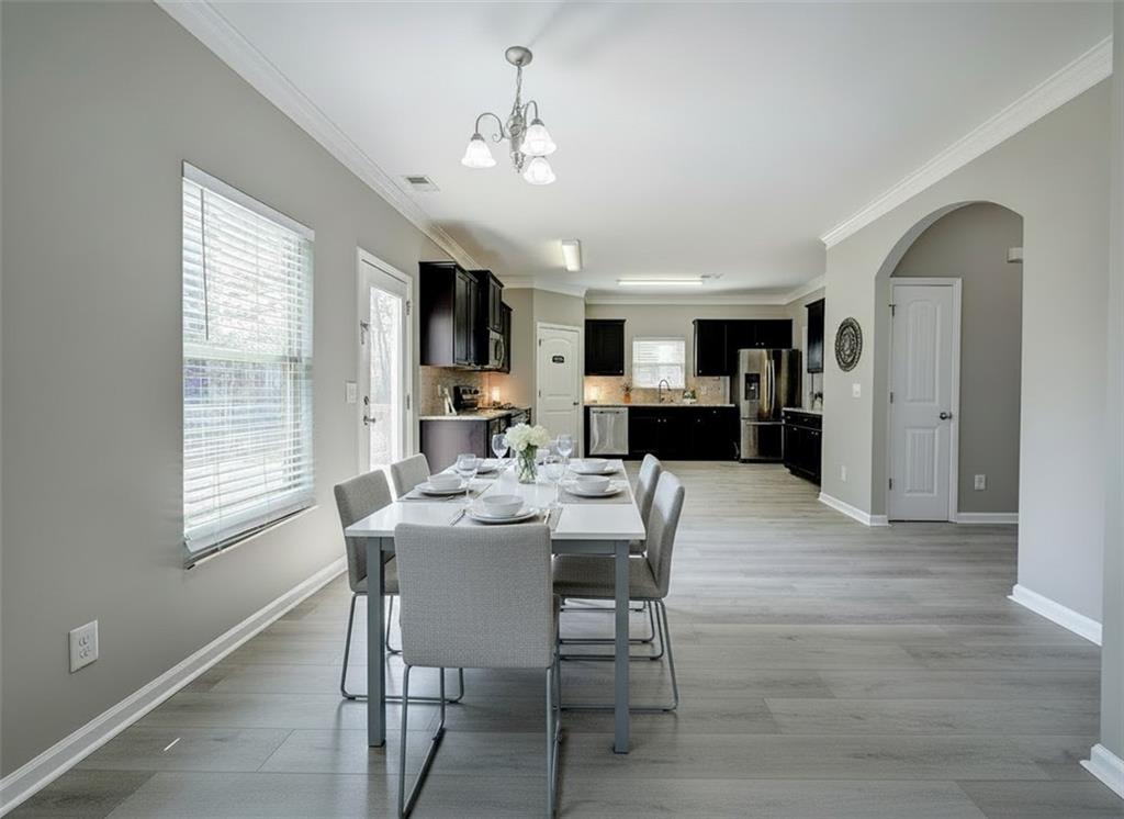 4 Timberland Trace Court Dallas, GA 30157 - Photo 15 of 53 a view of a dining room with furniture window and wooden floor
