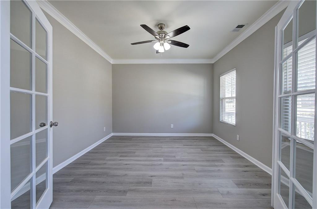 4 Timberland Trace Court Dallas, GA 30157 - Photo 18 of 53 an empty room with wooden floor and windows