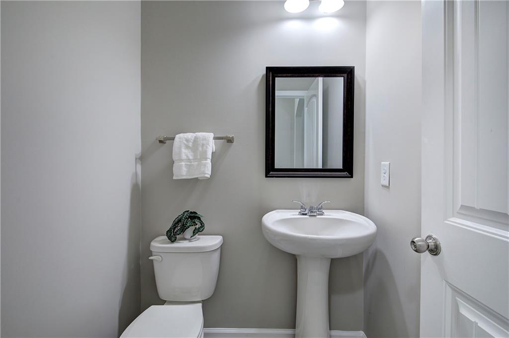 4 Timberland Trace Court Dallas, GA 30157 - Photo 22 of 53 a bathroom with a toilet a sink and mirror
