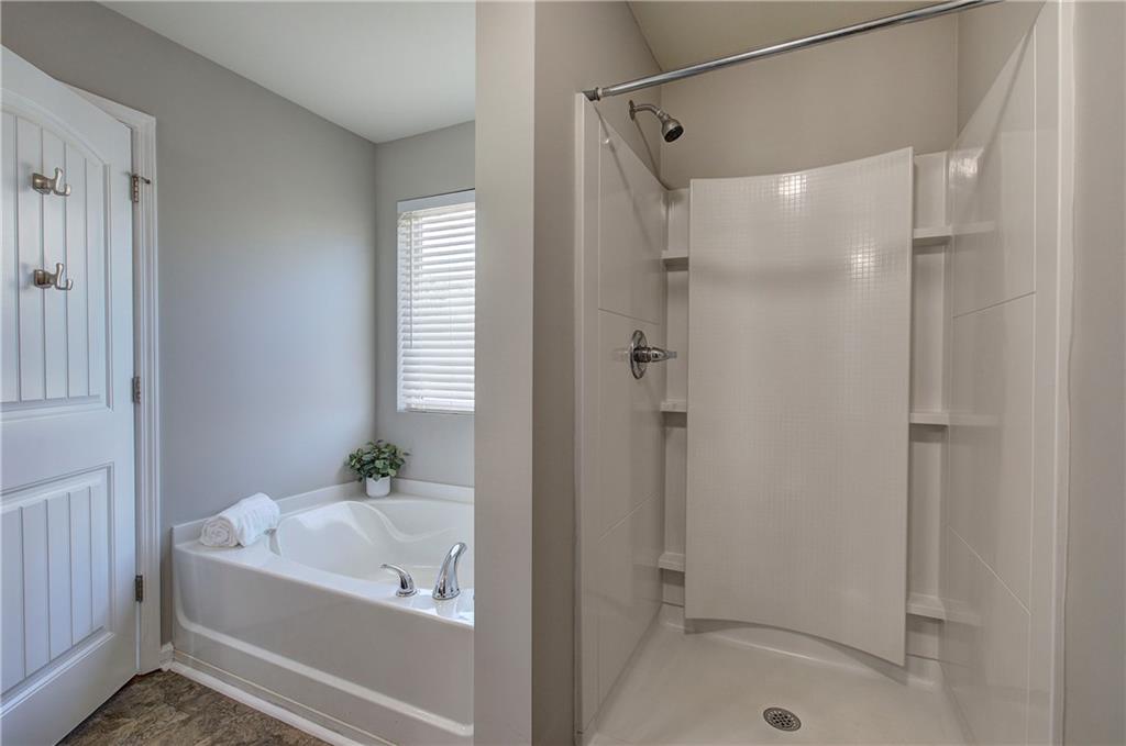 4 Timberland Trace Court Dallas, GA 30157 - Photo 29 of 53 a bathroom with a bathtub and a shower