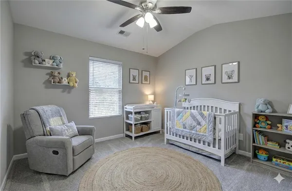 a bedroom with a bed and a couch