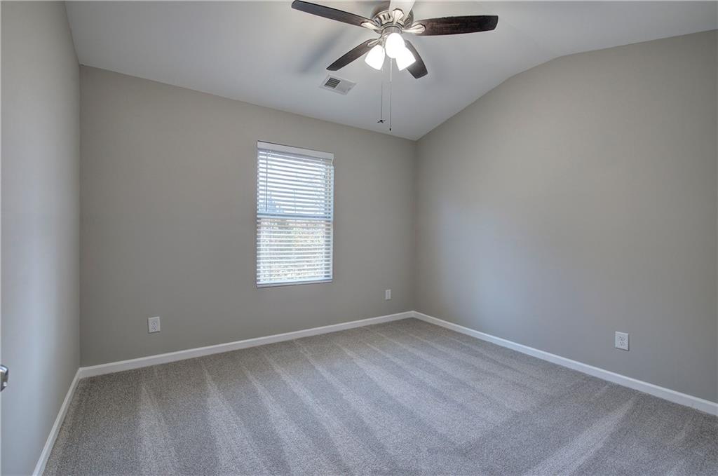 4 Timberland Trace Court Dallas, GA 30157 - Photo 35 of 53 an empty room with a window and a fan