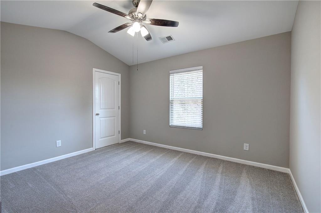 4 Timberland Trace Court Dallas, GA 30157 - Photo 39 of 53 an empty room with a window and a fan