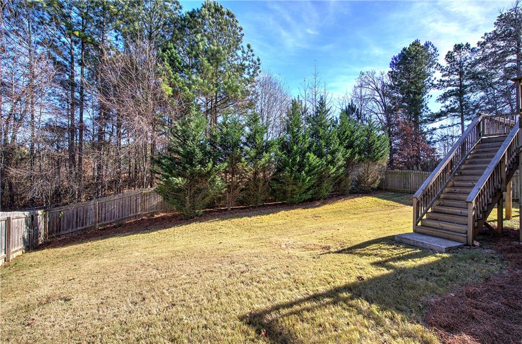 4 Timberland Trace Court Dallas, GA 30157 - Photo 44 of 53 a view of a backyard with plants and large trees