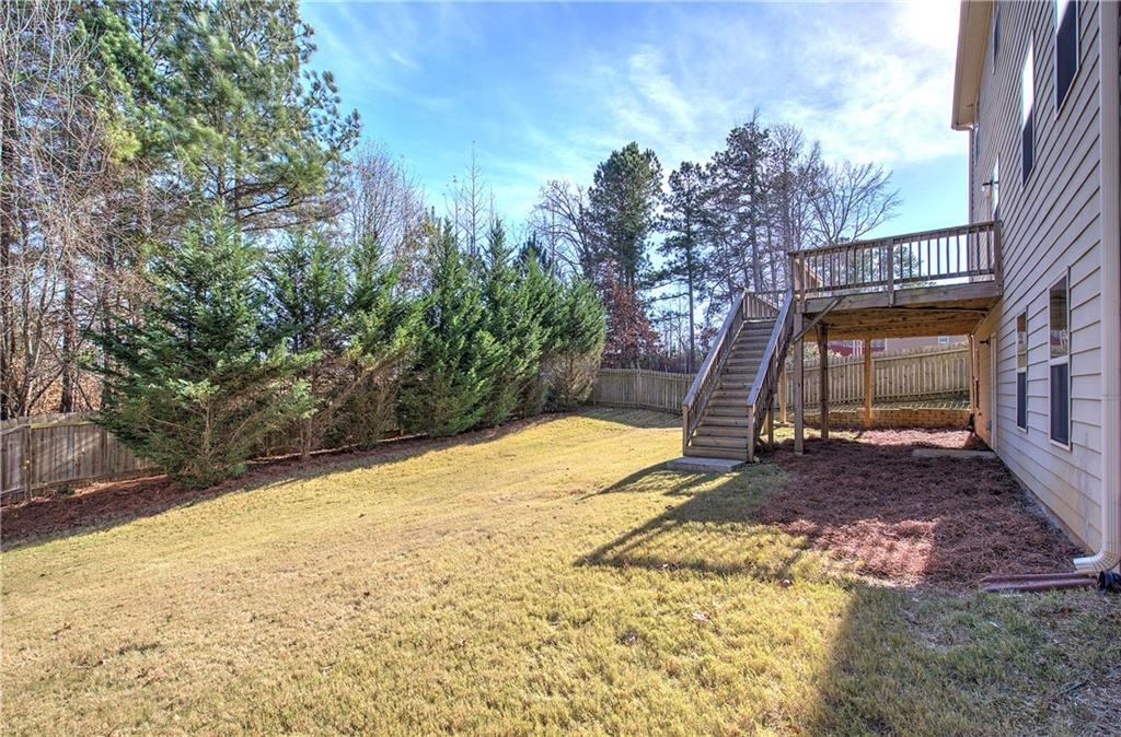 4 Timberland Trace Court Dallas, GA 30157 - Photo 45 of 53 a view of a backyard with a tree