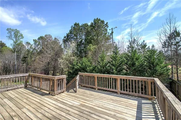a view of a yard with large trees