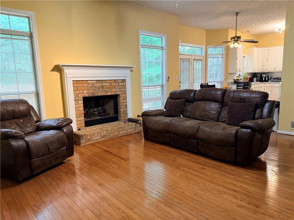426 Pates Lake Court Hampton, GA 30228 - Photo 47 of 60 a living room with furniture and a fireplace