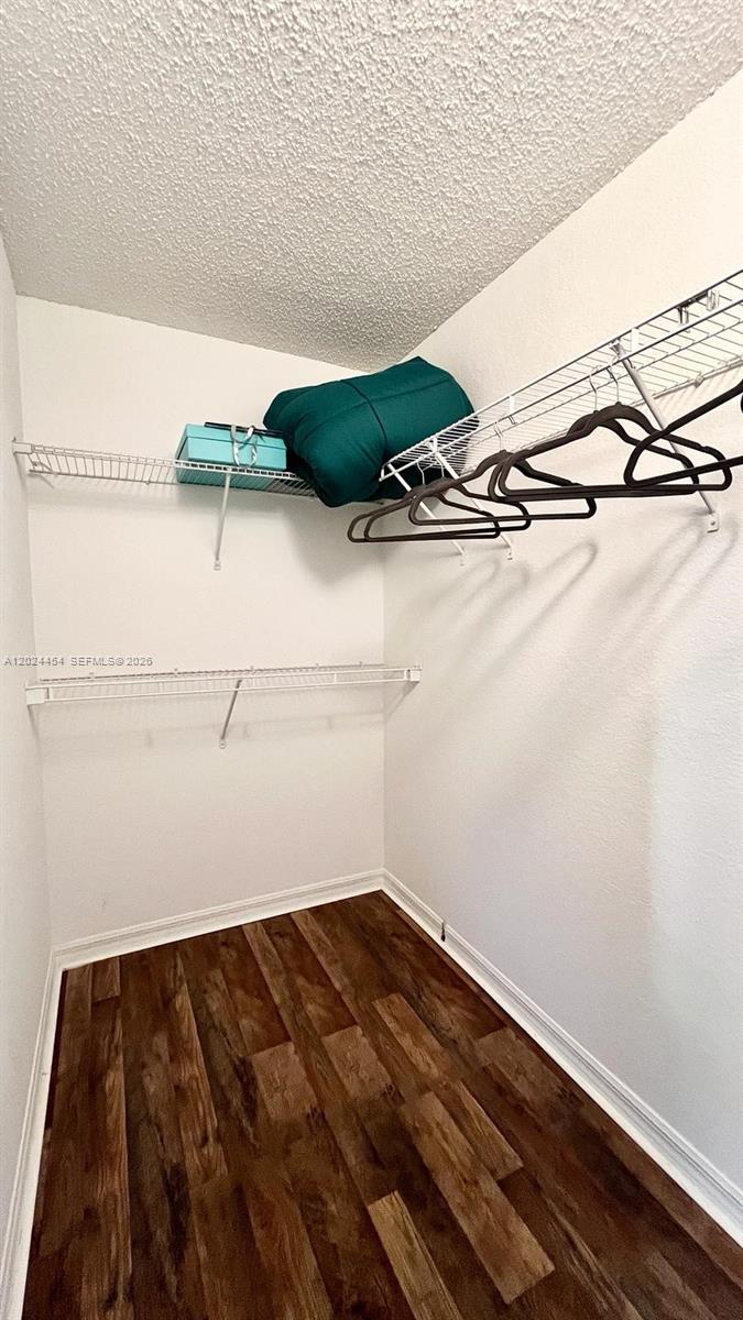 2727 Anzio Court, Unit 106 Palm Beach Gardens, FL 33410 - Photo 22 of 43 a view of a room with racks on the wall