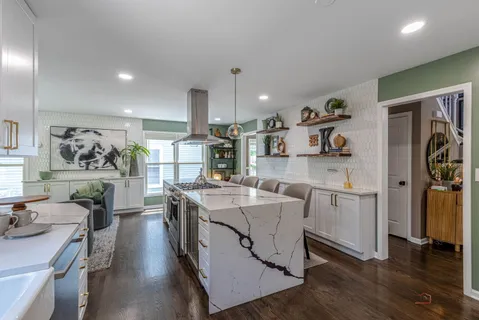 a open kitchen with stainless steel appliances granite countertop a lot of counter space cabinets and wooden floor