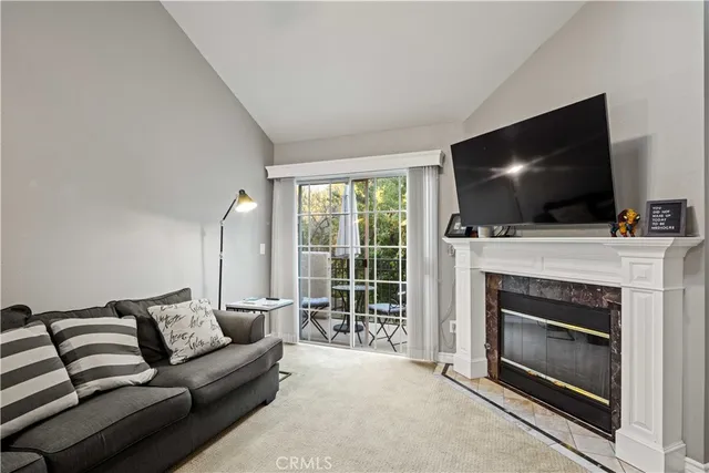 a bathroom with a granite countertop sink a mirror and shower