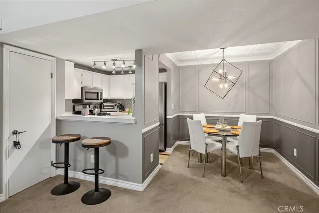 a room with table and chairs