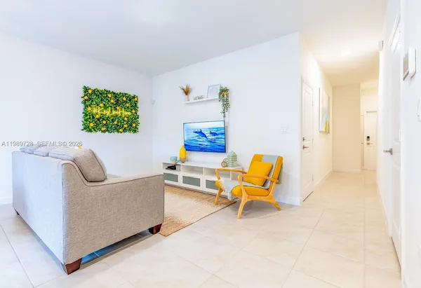 a living room with furniture and a couch
