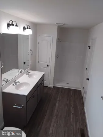 a bathroom with a sink and mirror