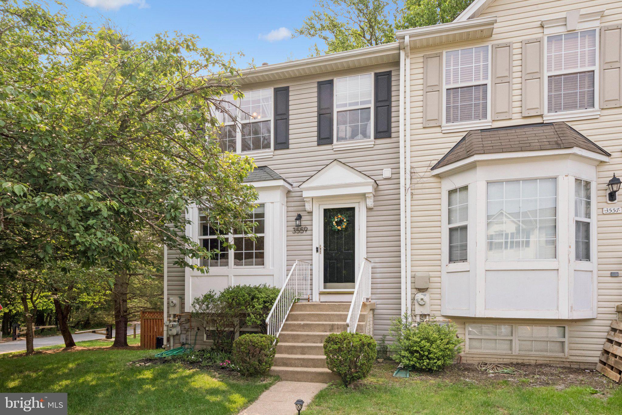 front view of a house with a yard